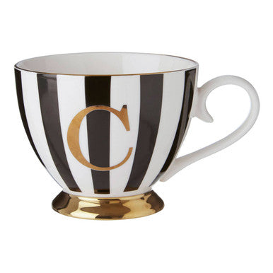 Black and white striped mug with gold letter &
