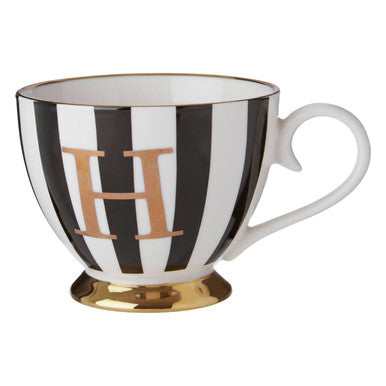 Black and white striped mug with gold letter &