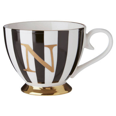Black and white striped mug with gold letter &