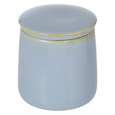 Light blue ceramic jar with gold lid on a white background