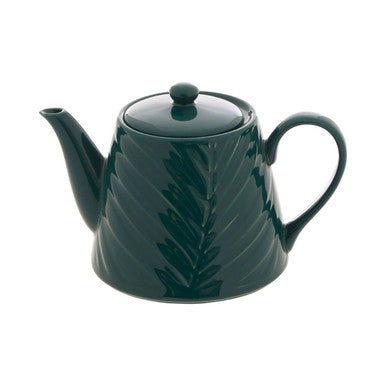 Green teapot with leaf design on a white background