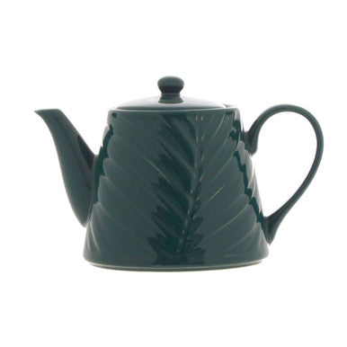 Green teapot with leaf design on a white background
