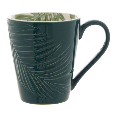 Green mug with leaf pattern on a white background