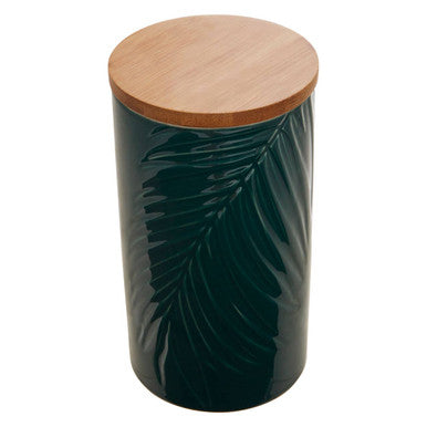 Dark green cylindrical container with leaf patterns and a wooden lid on a white background