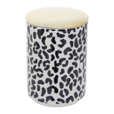 Cylindrical container with black leopard print pattern and beige lid on a white background