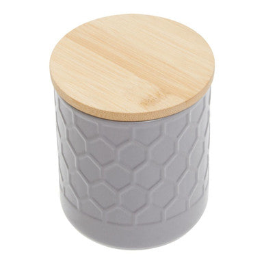 Gray textured jar with a wooden lid on a white background