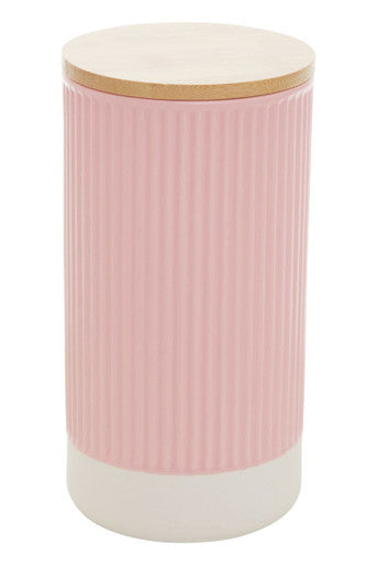 Pink cylindrical container with a wooden lid on a white background