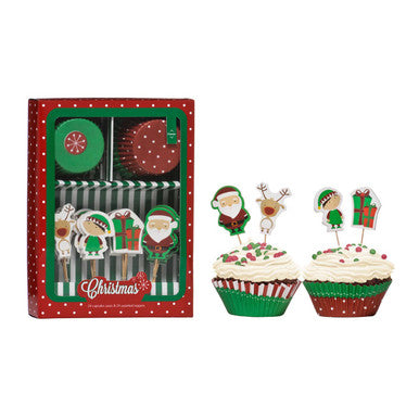 Set of Christmas-themed cupcake toppers with Santa Claus, reindeer, and gift box designs, displayed with packaging.