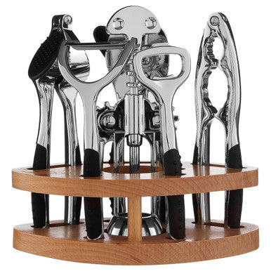 Set of kitchen tools including a bottle opener, can opener, and jar opener in a wooden holder on a white background.