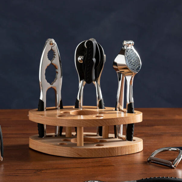 Set of corkscrews on a wooden stand with a dark background