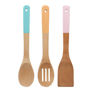 Three wooden utensils with colorful handles on a white background