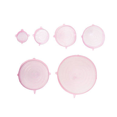 Set of pink mesh laundry bags of different sizes on a white background