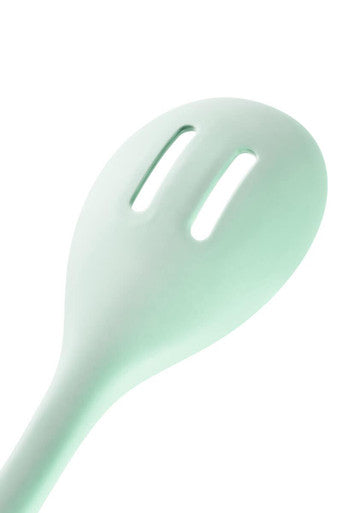 Light green spoon on a white background