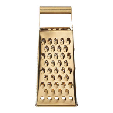 Gold metal box grater on a white background