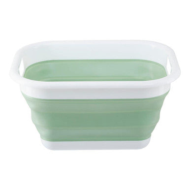Collapsible green plastic basin on a white background