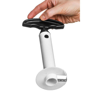 Hand holding a white kitchen tool with black handle on a white background