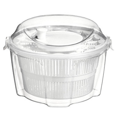Clear plastic salad spinner on a white background