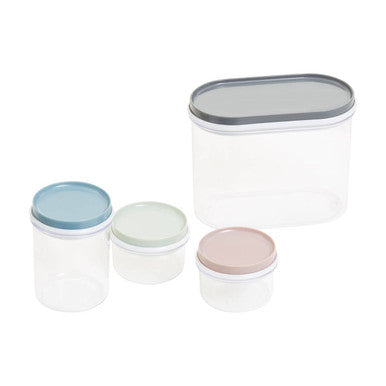 Set of four glass containers with lids on a white background