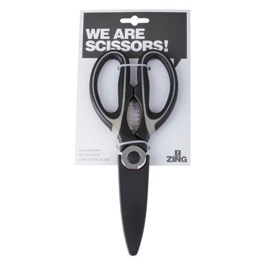 Black scissors with silver blades in packaging labeled &
