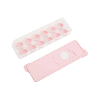 Pink ice cube tray with pink cover on a white background