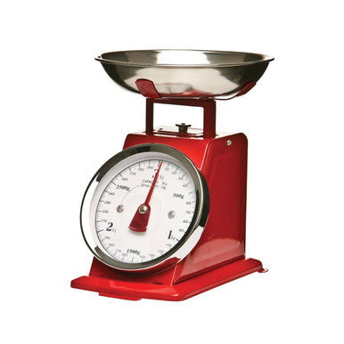 Red kitchen scale with a metal bowl on a white background