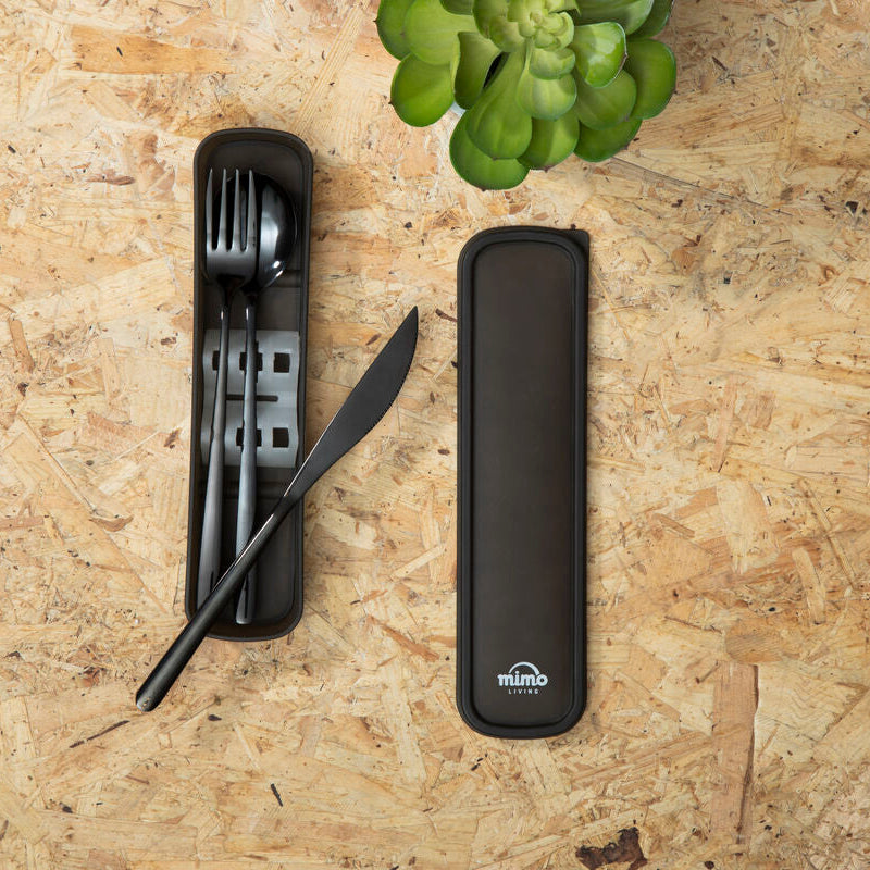 Black portable cutlery set with case on a wooden surface