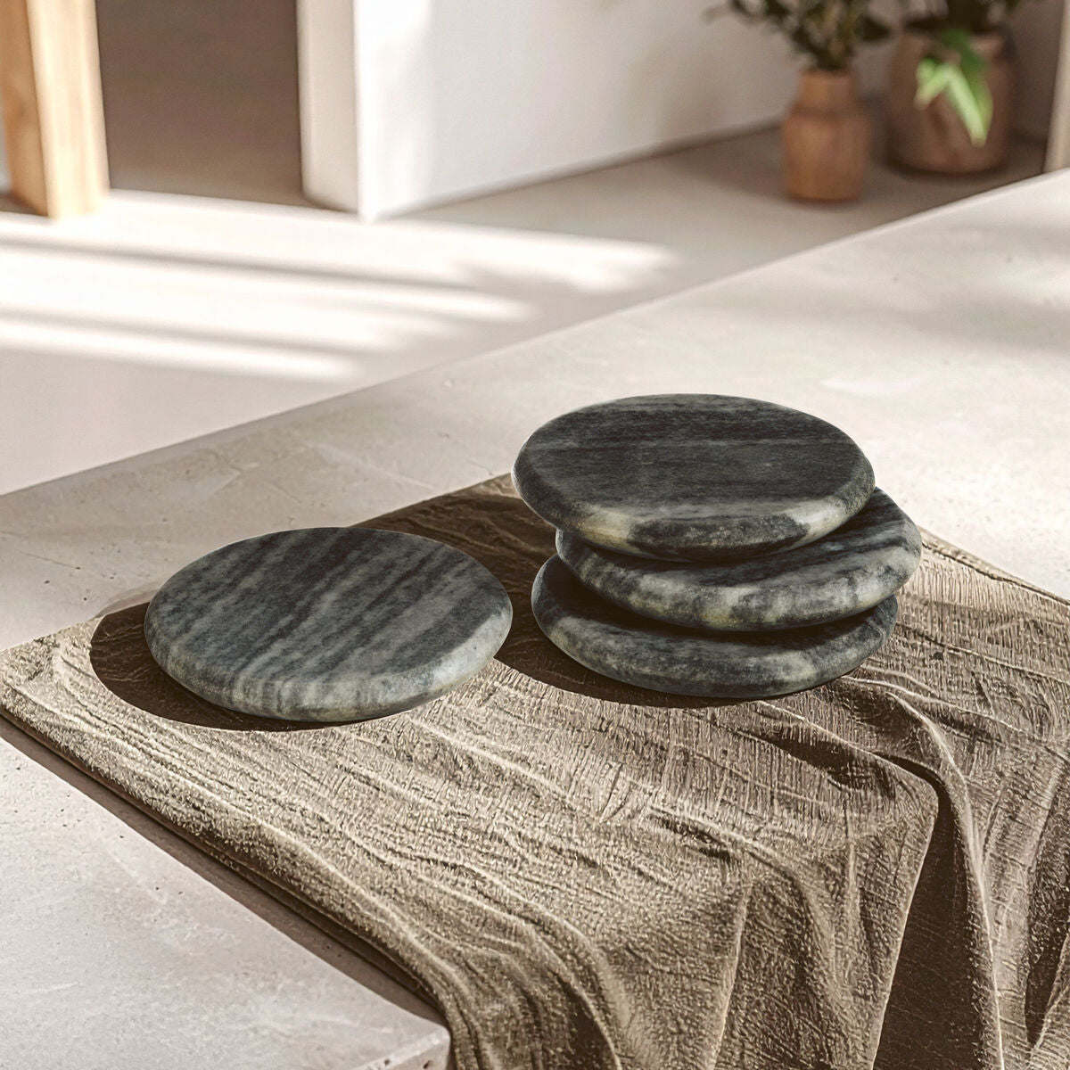 Set of green stones on a wooden surface with a neutral background
