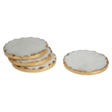 Two round cookies with white icing and gold borders on a white background