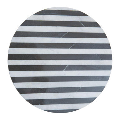 Round marble coaster with black and white striped pattern on a white background
