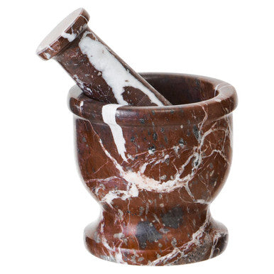 Marble-patterned mortar and pestle on a white background