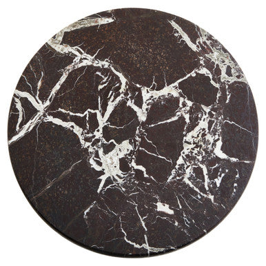 Round black marble coaster with white veins on a white background