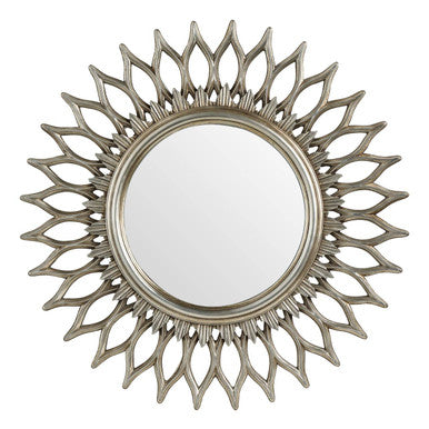 Decorative sunburst mirror with a metallic finish on a white background