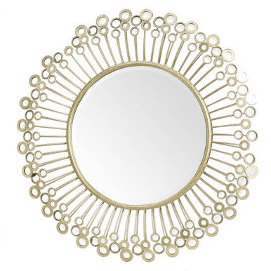Decorative gold mirror with circular design on a white background