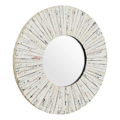 Round mirror with a decorative, sunburst-style frame on a white background