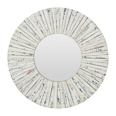 Round mirror with a decorative frame on a white background