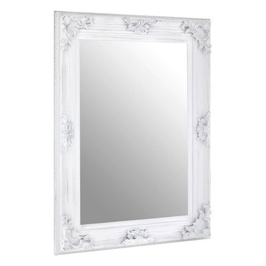 Decorative white mirror with intricate carvings on a white background