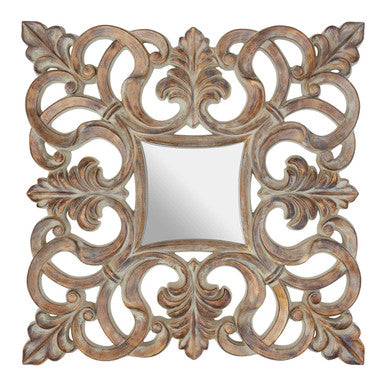 Decorative square mirror with intricate carvings on a white background