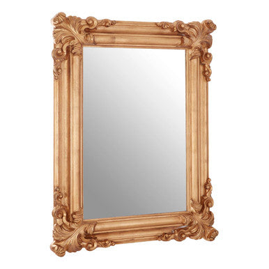 Decorative gold mirror with intricate detailing on a white background