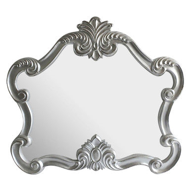Decorative silver mirror with intricate patterns on a white background