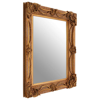Decorative gold-framed mirror on a white background