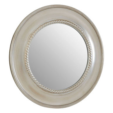 Round mirror with decorative silver frame on a white background