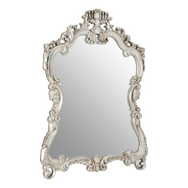 Decorative mirror with intricate white frame on a white background