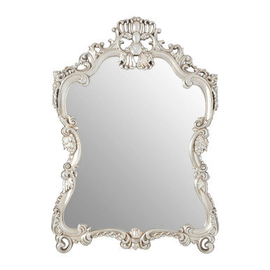 Decorative wall mirror with intricate white frame on a white background