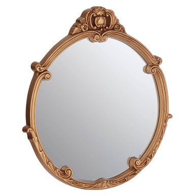 Decorative gold-framed mirror on a white background