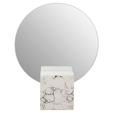 Round mirror with a marble base on a white background