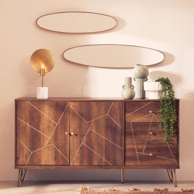 Wooden sideboard with geometric design in a room with decorative elements.