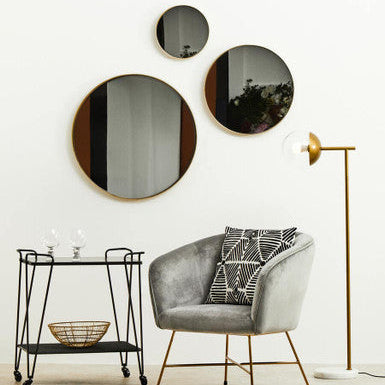 Round mirror with a gold frame