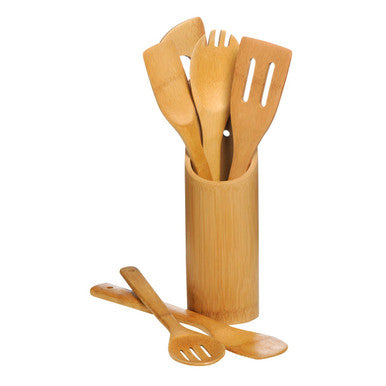 Set of wooden kitchen utensils in a cylindrical holder on a white background