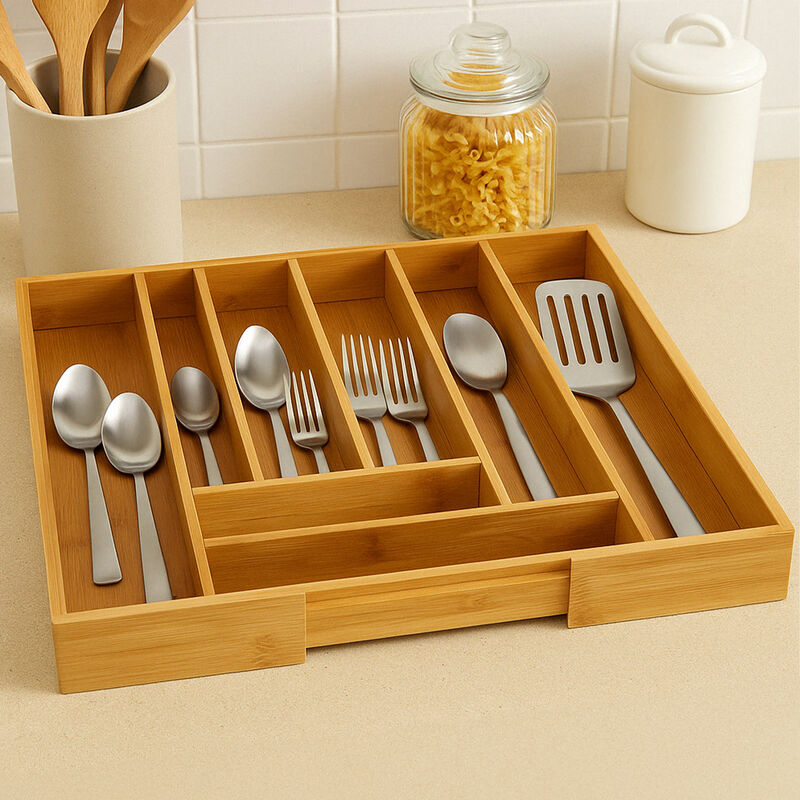 Wooden cutlery organizer with silverware on a kitchen counter