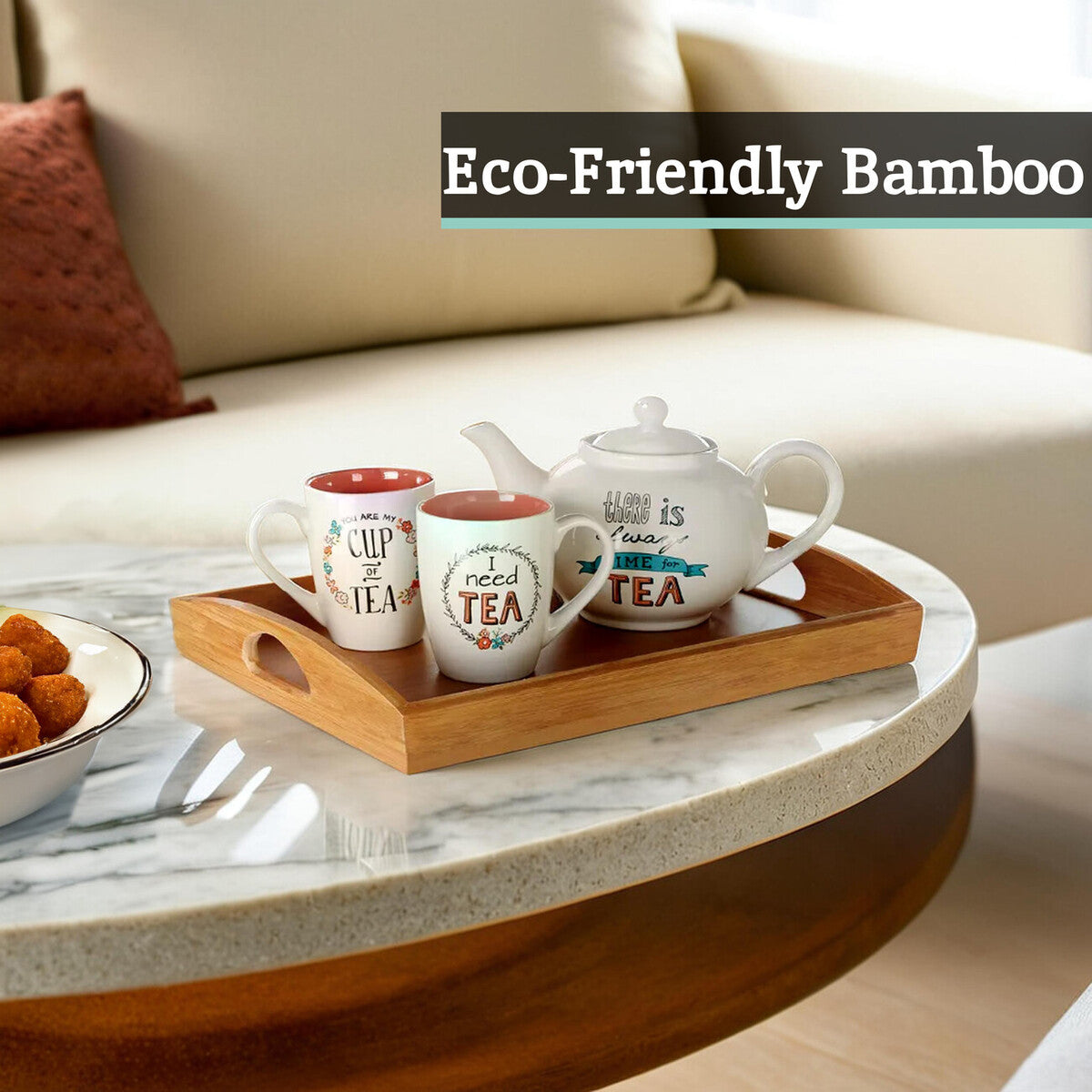 Tea set with mugs and a teapot on a wooden tray in a living room setting.